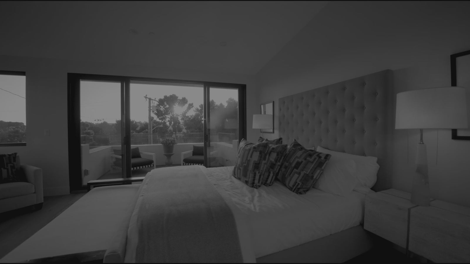 luxury bedroom with windows and sunlight