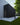 dark stained horizontal wood siding on modern building with green grass and tree